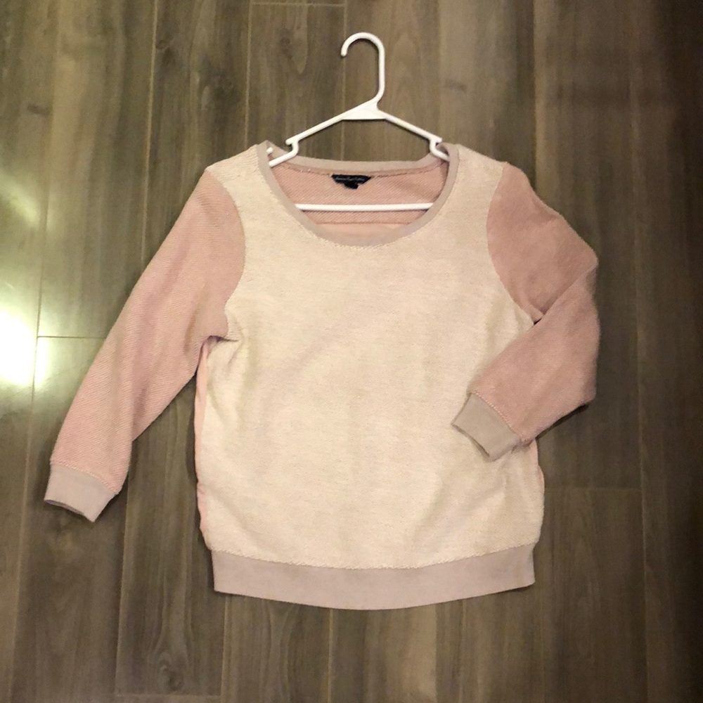 Soft pink sweater with cropped back
